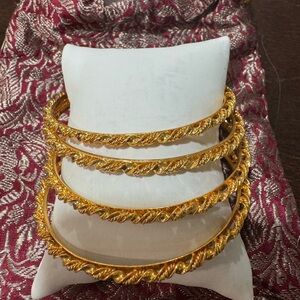 Set of 4 gold bangles